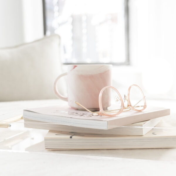 Mug with books and reading glasses