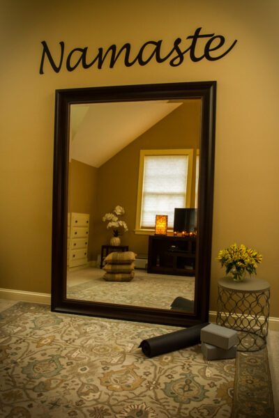 Large mirror in home yoga and meditation space