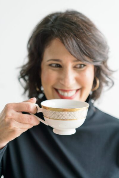 Woman with tea cup smiling
