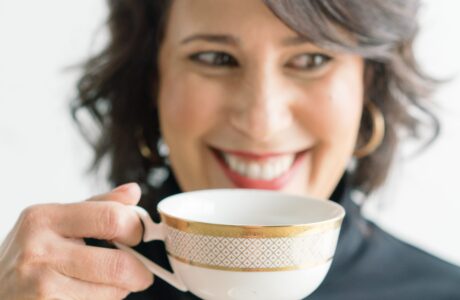 Woman with tea cup smiling