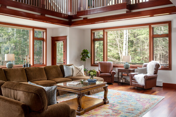 Great Room with coffee table and large sectional in mountain vacation home