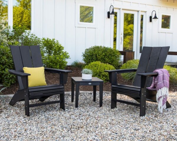 Outdoor chairs on gravel with house behind