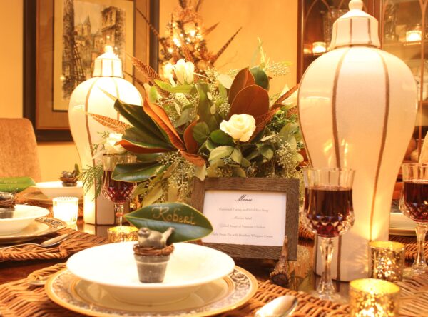 Christmas tablescape with vases fresh floral centerpiece and china